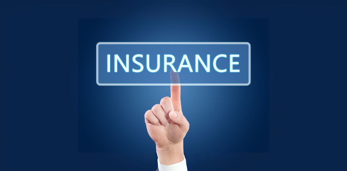 A hand pointing at the word insurance on a glowing blue screen